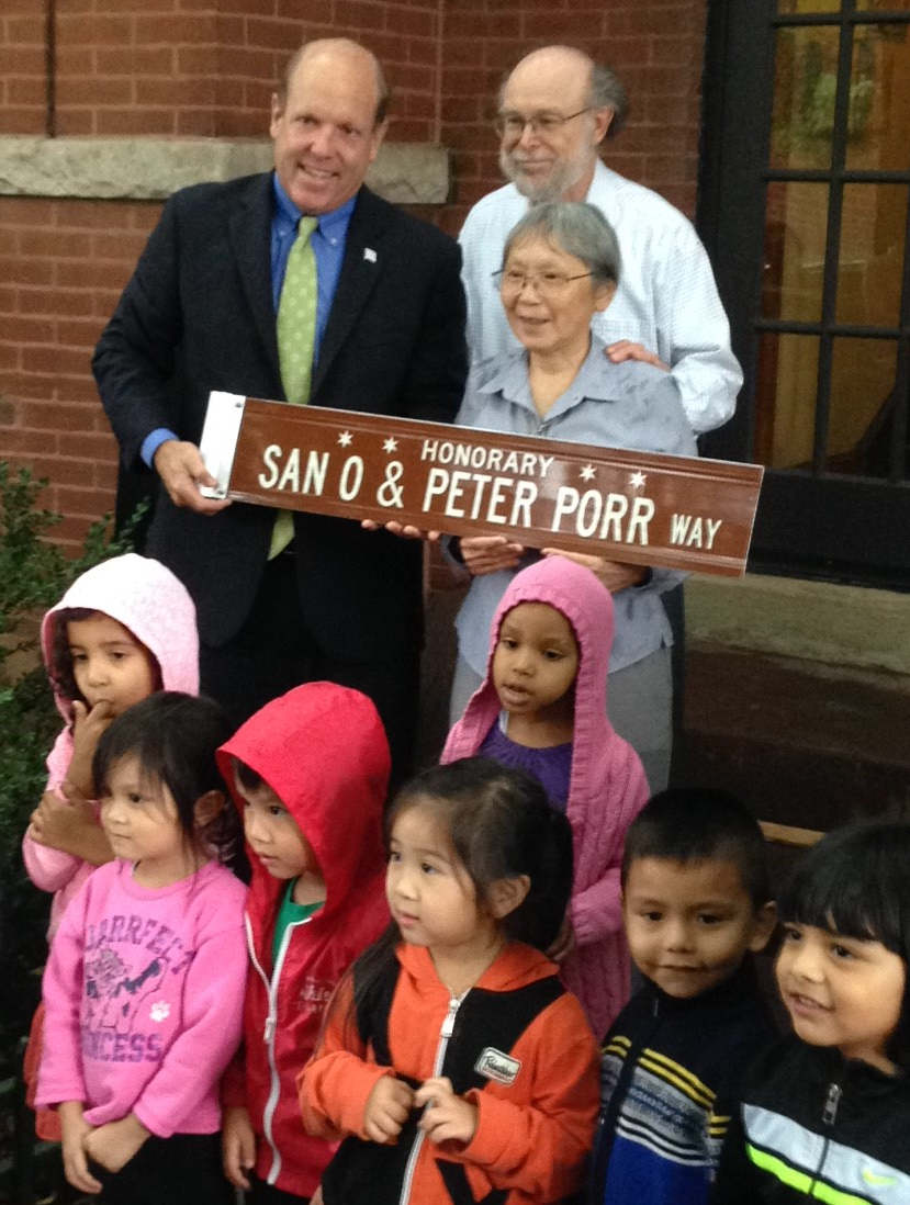 Alderman Harry Osterman, Peter Porr San O and SEAC children at honorary street naming on Ainslie east of Broadway.